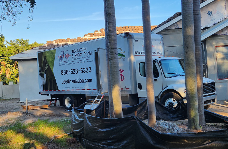 Leed Insulation Truck parked outside a residential project