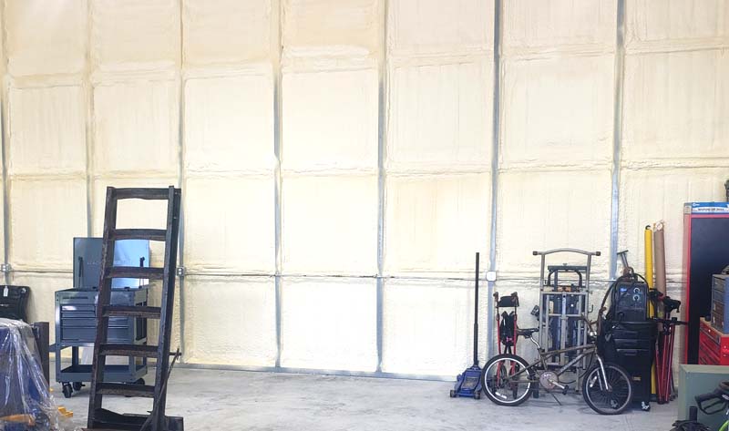Leed Insulation R-14 closed-cell spray foam insulation covering metal building walls in Fort Pierce, FL.