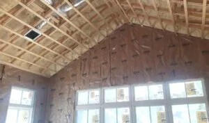 Leed Insulation CertainTeed kraft-faced fiberglass batt insulation on walls with radiant barrier on the vaulted ceiling in a new construction home in Fort Pierce, FL.
