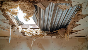 Residential home with ceiling water damage and insulation water damage